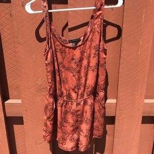 orange romper with flowers